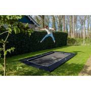 Trampoline buried at ground level with freezone safety tiles Exit Toys Dynamic 275 x 458 cm
